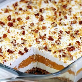 Pumpkin Lush – this fast-made, light, yet delicious creamy dessert, with cheese cream and pumpkin layers, and gingersnap cookie crust, topped with chopped pecans and gingersnap cookie crumbs, will delight all the pumpkin lovers