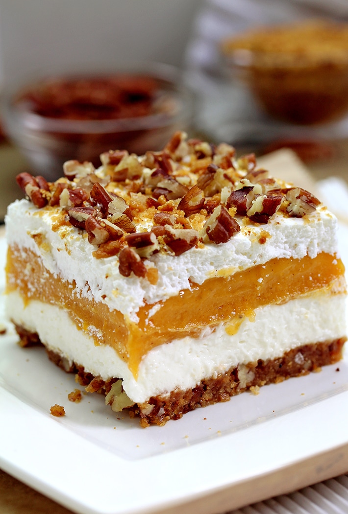 Pumpkin Lush – this fast-made, light, yet delicious creamy dessert, with cheese cream and pumpkin layers, and gingersnap cookie crust, topped with chopped pecans and gingersnap cookie crumbs, will delight all the pumpkin lovers
