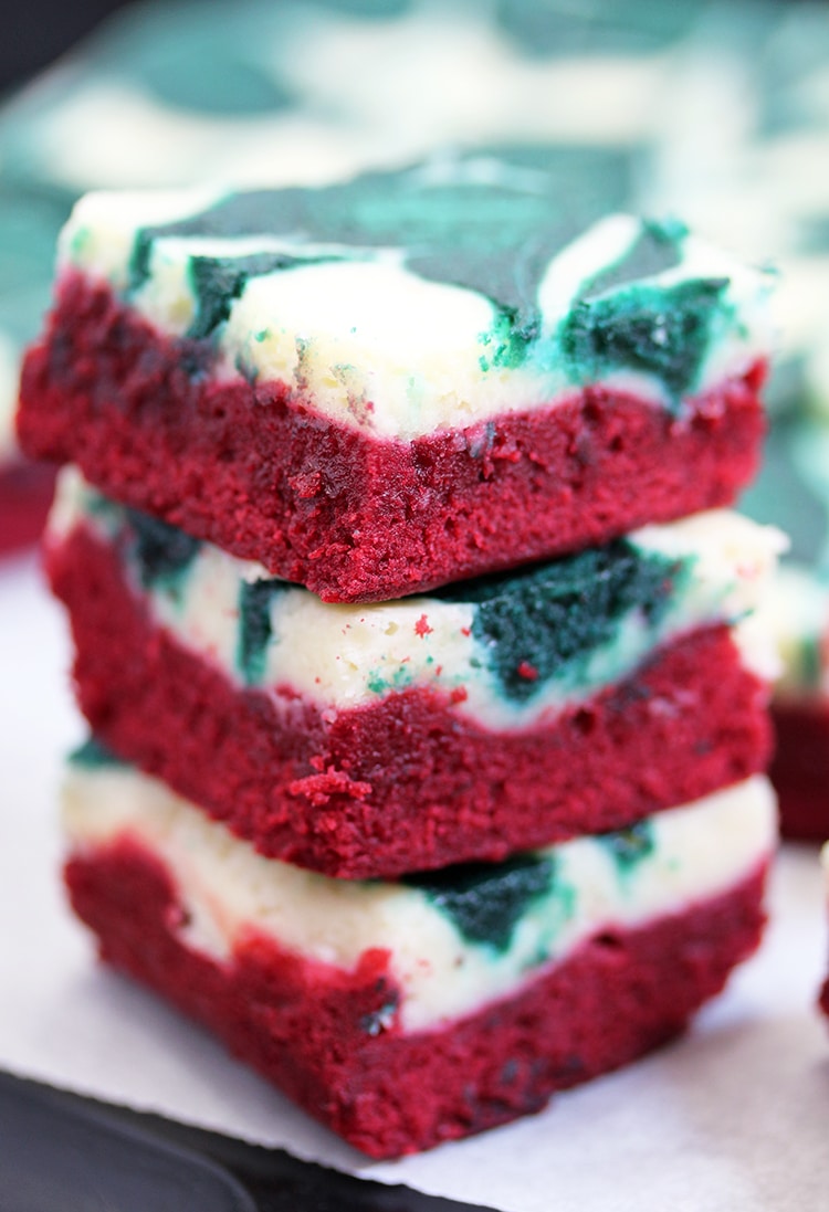 Christmas Cheesecake Swirl Brownies are quick and easy, super tasty brownies with a red velvet brownie layer, a cheesecake layer and swirl with green velvet brownies.