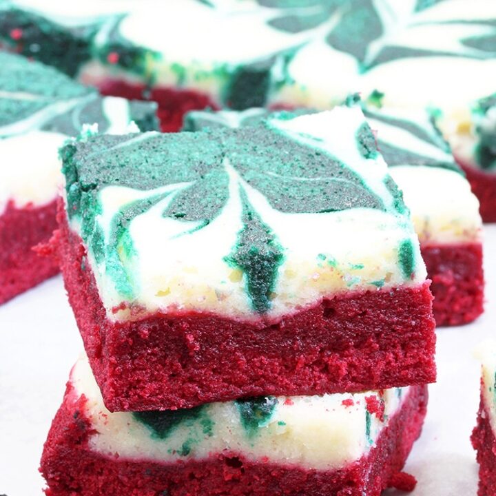 Christmas Cheesecake Swirl Brownies are quick and easy, super tasty brownies with a red velvet brownie layer, a cheesecake layer and swirl with green velvet brownies