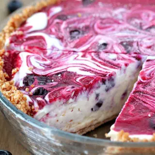 Very Berry Frozen Cream Pie is a dessert with fresh season blueberries and raspberries, just perfect refreshment for hot summer days. If you like ice cream, especially fruit, you will love this pie. This is one of my favorite summer desserts. Graham cracker pie crust, frozen cream, swirls with homemade blueberry and raspberry filling... Pure perfection, if you ask me.