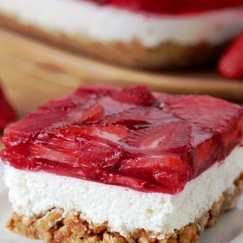 Strawberry Jello Pretzel Salad is a very tasty, old fashioned dessert that is so easy to prepare and that everyone loves. It consists of three different layers. The first one is made of crushed pretzels, sugar and melted butter and it´s baked for 10 minutes. Then, the second layer made of cream cheese, sugar and cool whip comes. For the third layer you will need strawberries, strawberry jello and water.