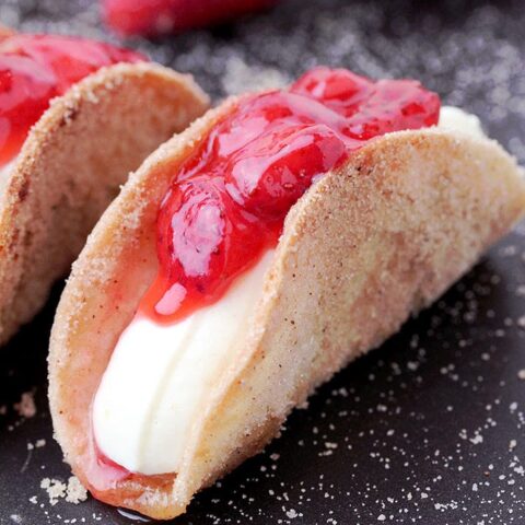 Strawberry Cheesecake Tacos – crunchy cinnamon and sugar tortilla shells, filled with cheesecake and topped with homemade strawberry sauce are perfect bites for every occasion. They are so easy to make, they look great and taste even better.