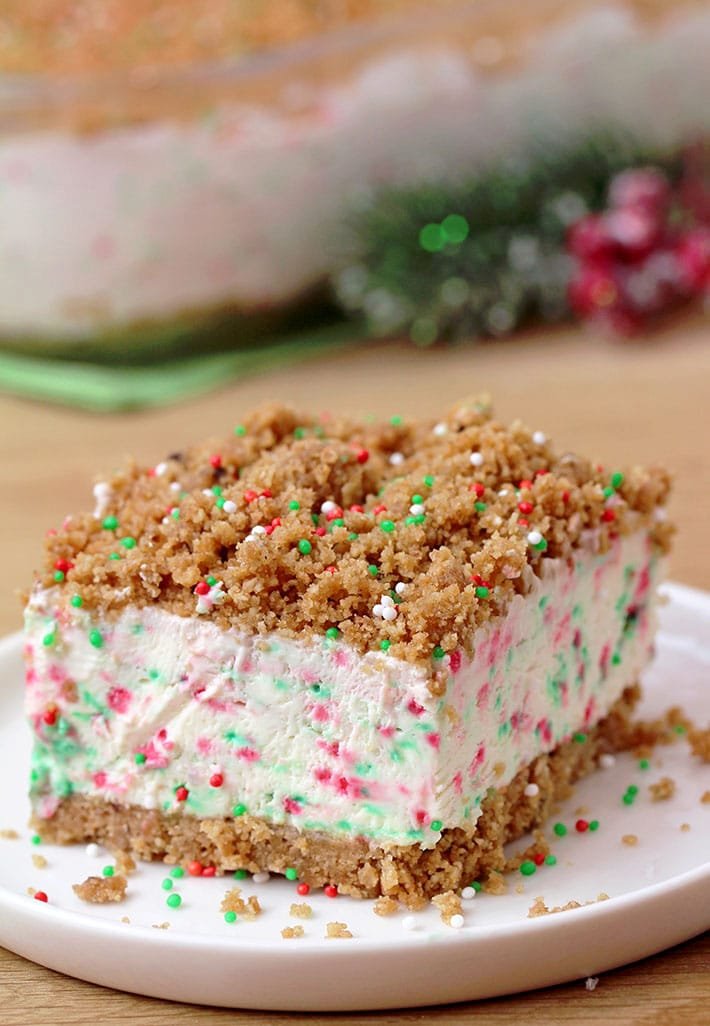 Frozen Christmas Dessert – this unique dessert has crunchy base and top and frozen, creamy filling with sprinkles in Christmas colors. A combination of filling made with cream cheese, sweetened condensed milk and whipped cream, with base and top made of graham crackers, simply has to be tried. It is so quick and easy to prepare and the taste is amazing.