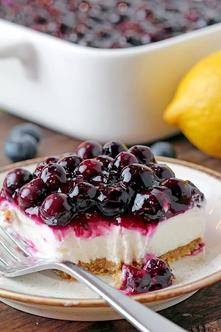 No Bake Blueberry Cheesecake – is a delicious dessert made with a buttery graham cracker crust, no bake cheesecake filling, topped with homemade blueberry sauce. Crusty base, cream filling and fruit topping – three different flavors and textures make a perfect combination.