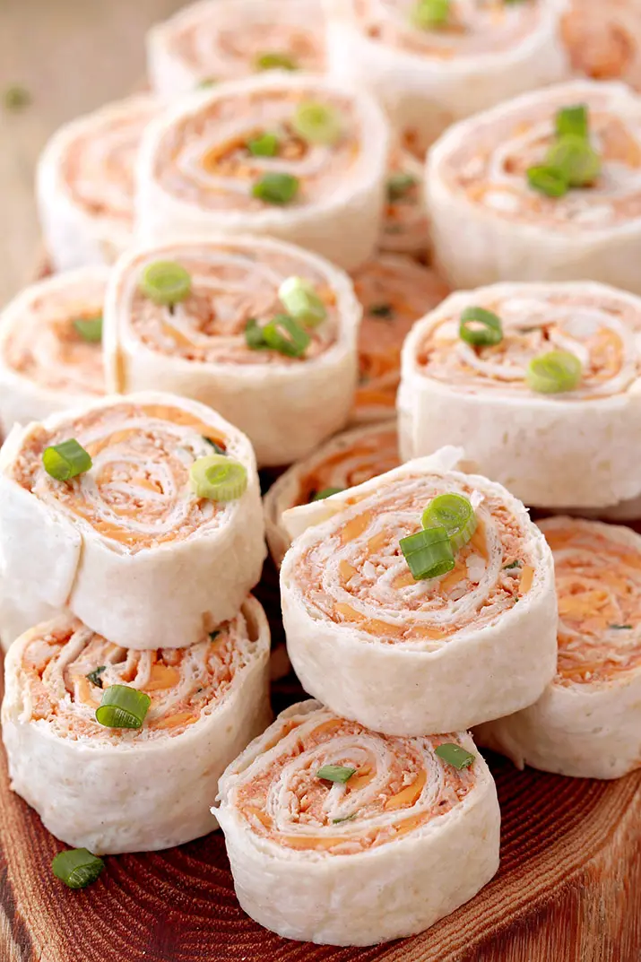 Buffalo Chicken Tortilla Roll Ups – looking for a perfect appetizer that is quick and easy to make? You’re in the right place! These Buffalo Chicken Tortilla Roll Ups are made with cream cheese, cheddar cheese, blue cheese, hot sauce, green onions, chicken, garlic powder and tortillas. 