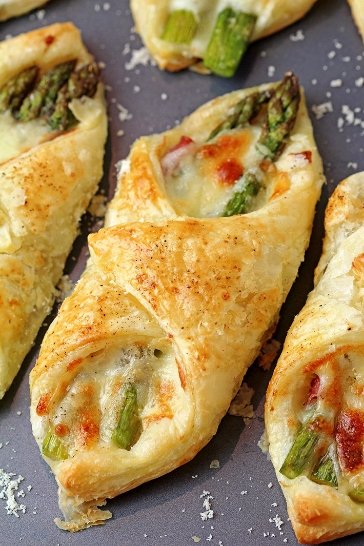 These Prosciutto Asparagus Puff Pastry Bundles are one of the easiest and most delicious appetizers I have ever made and they will surely knock you off your feet. Prosciutto, fresh asparagus, mozzarella and parmesan are all tucked in a flaky, buttery puff pastry and have a very rich taste.