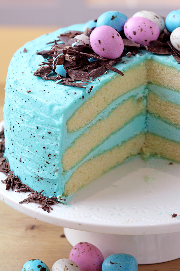 Speckled Egg Easter Cake – layers of soft vanilla cake with silky butter vanilla cream colored in blue and speckled pastel Easter eggs are a perfect choice for Easter dessert! 