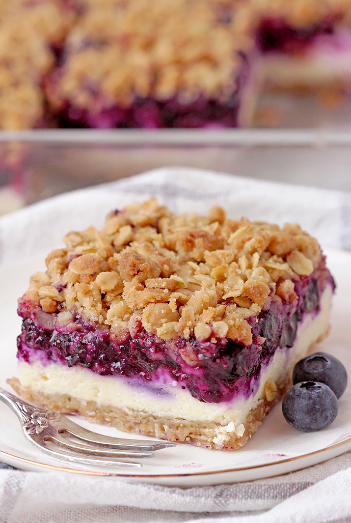Blueberry Crisp Cheesecake Bars - crispy crust and topping, creamy cheesecake layer and juicy blueberry filling are incredible layers that make this dessert so delicious. I love creamy crunchy combinations. What I especially like about this dessert is that both the crust and the topping are the same - double dose of crunchiness!