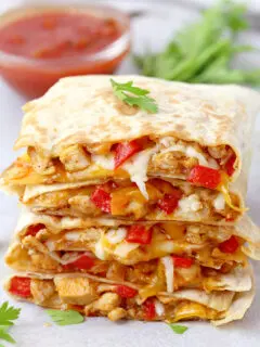 Easy Cheesy Chicken Quesadillas – this Mexican dish is so easy to make and it’s a perfect meal that can be prepared in no time! It can be a quick go-to lunch or a weeknight dinner made from simple ingredients with perfect taste. Crunchy tortillas filled with juicy chicken with lots of melted cheddar cheese and mozzarella, as well as pepper, taco sauce and taco seasoning are so delicious.