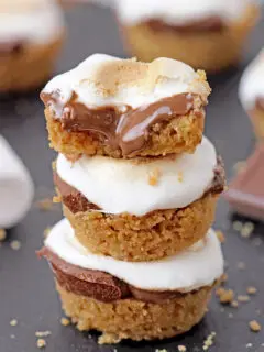 S’ mores Bites – only 5 ingredients and 18 minutes of your time is everything you need to make these incredibly delicious bite – size treats. Mini buttery graham crackers cups, melted Hershey chocolate inside, topped with gooey toasted marshmallows – a perfect combination!