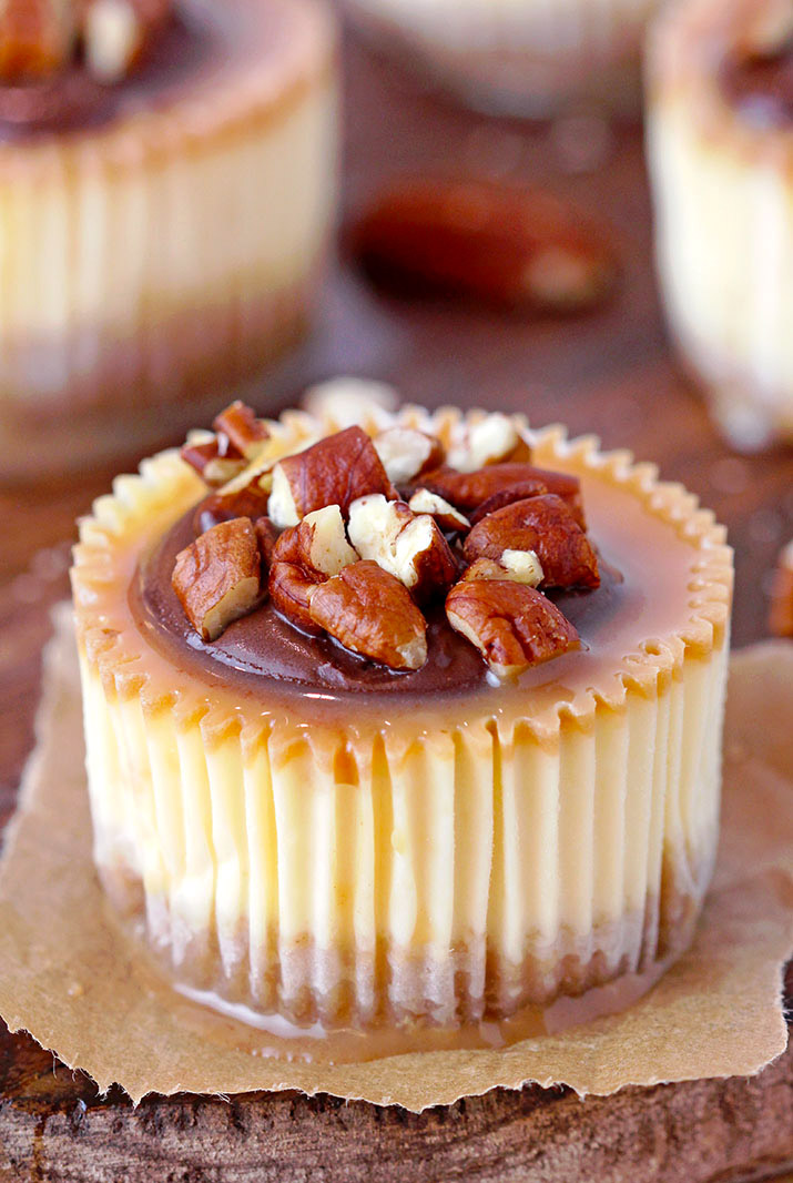 Turtle Mini Cheesecakes – graham cracker crust, creamy cheesecake, turtle topping made of caramel sauce, chocolate and pecans make these rich mini cheesecakes simply irresistible. They’re perfect for holidays and special events.